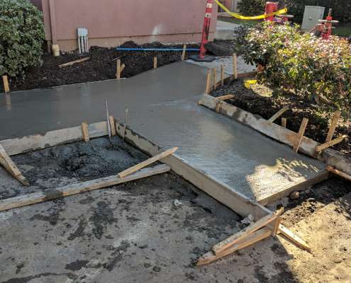 Concrete sidewalk project in progress.