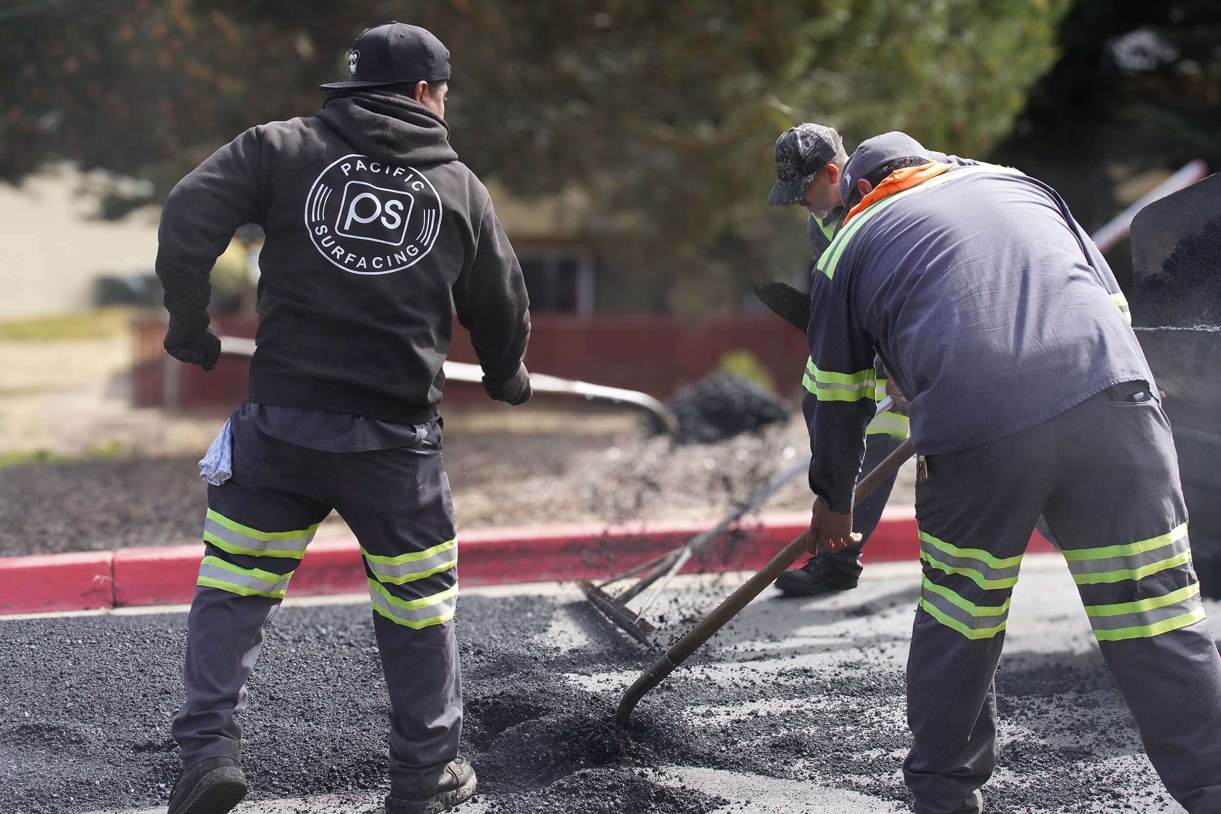 Pacific Surfacing team members working on an asphalt paving project in San Jose California