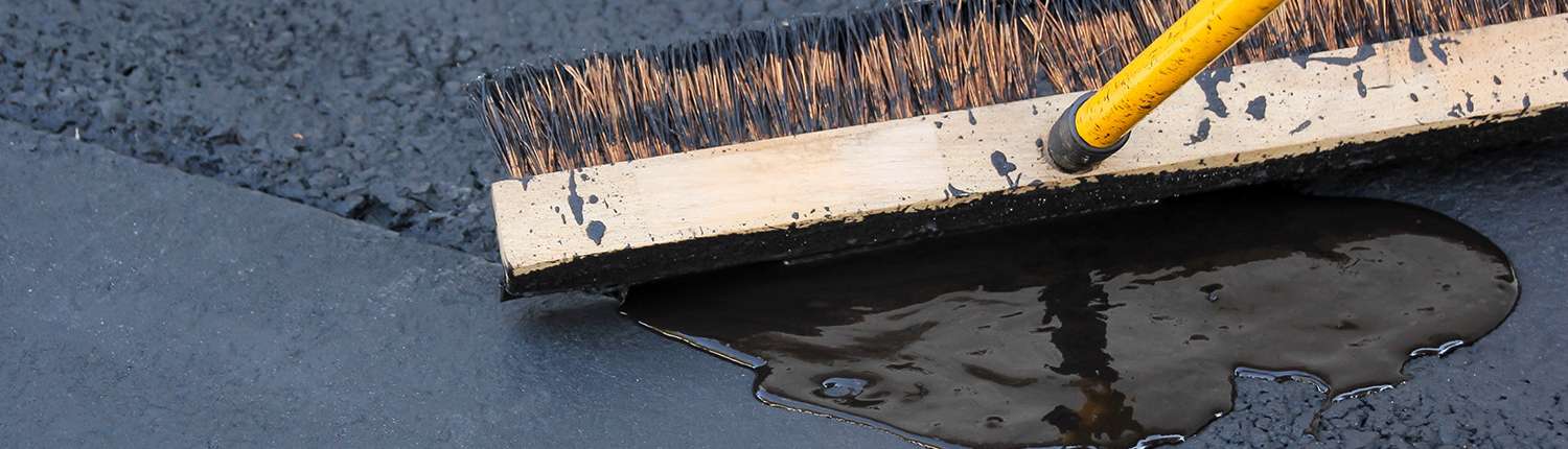 Close-up of sealcoating broom.