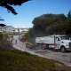 Pacific Surfacing completing commercial paving along a sloped neighborhood road.
