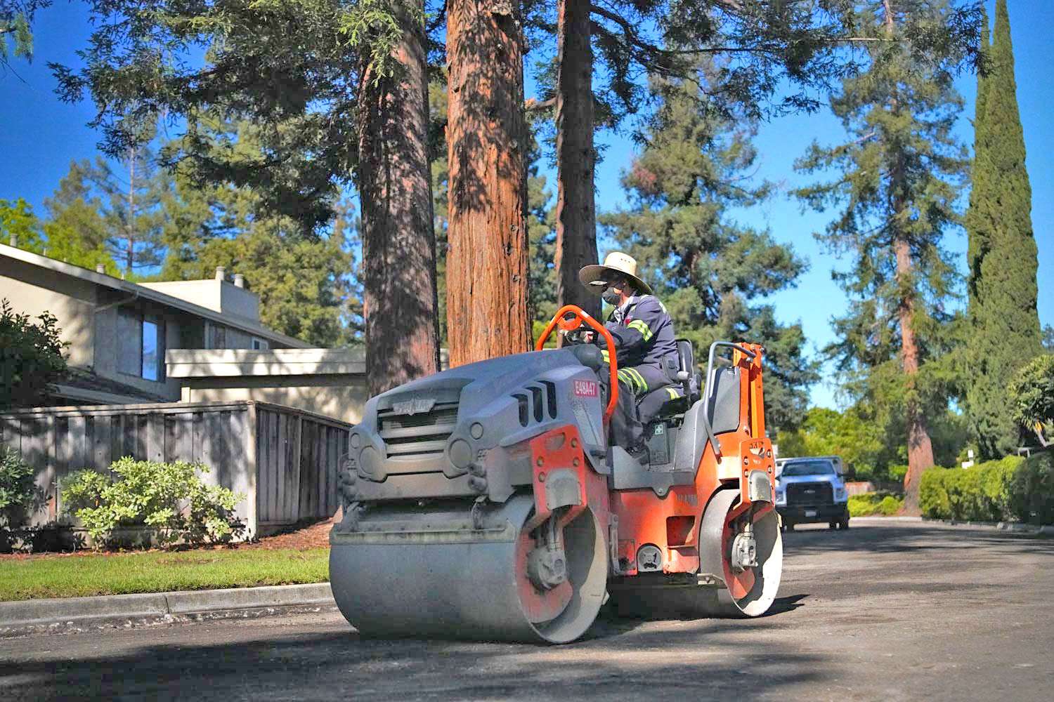 Pacific Surfacing crew member paving a neighborhood.