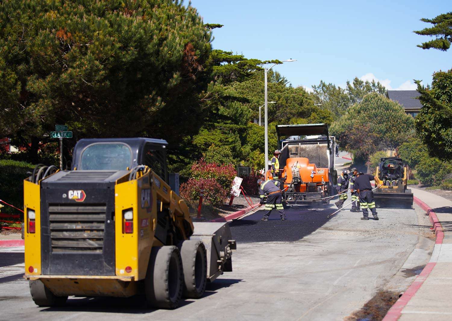 Pacific Surfacing crew members paving asphalt.