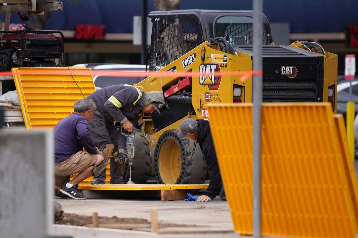 Pacific Surfacing crew members assembling ADA ramps.