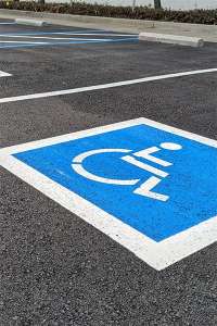 Painted parking space lines with the accessibility symbol.